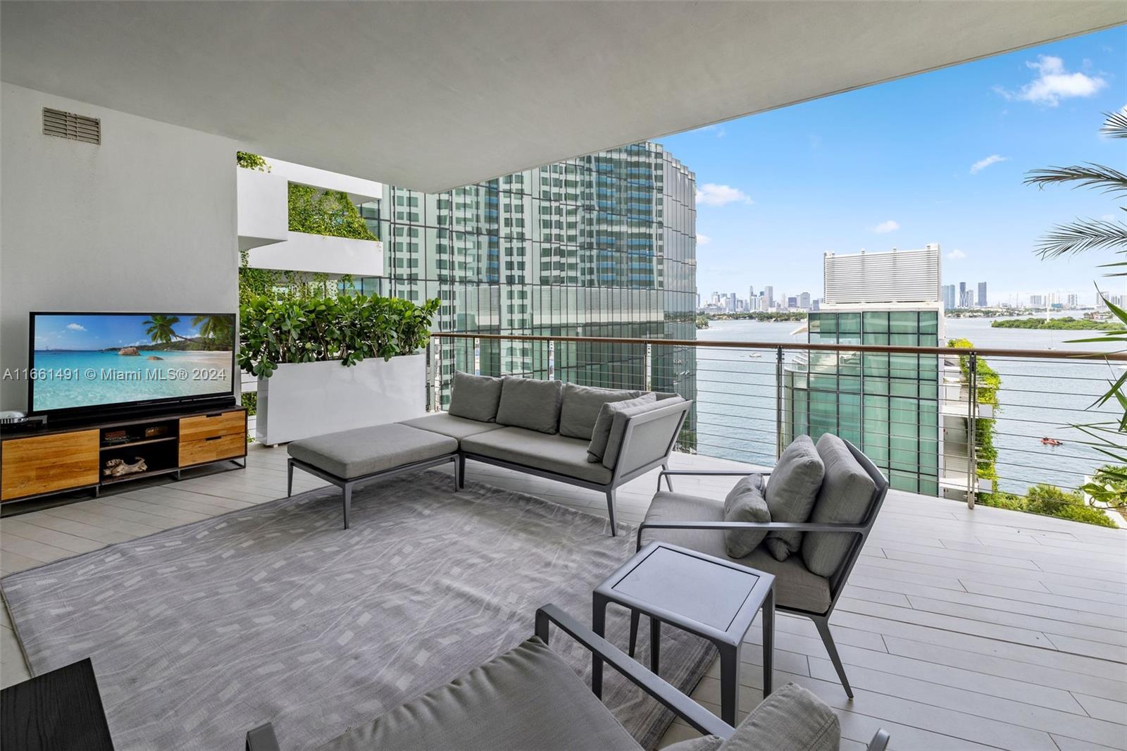1300 Monad Terrace, Unit 9B Miami Beach, FL 33139 - Photo 6 of 34 a living room with furniture and a floor to ceiling window