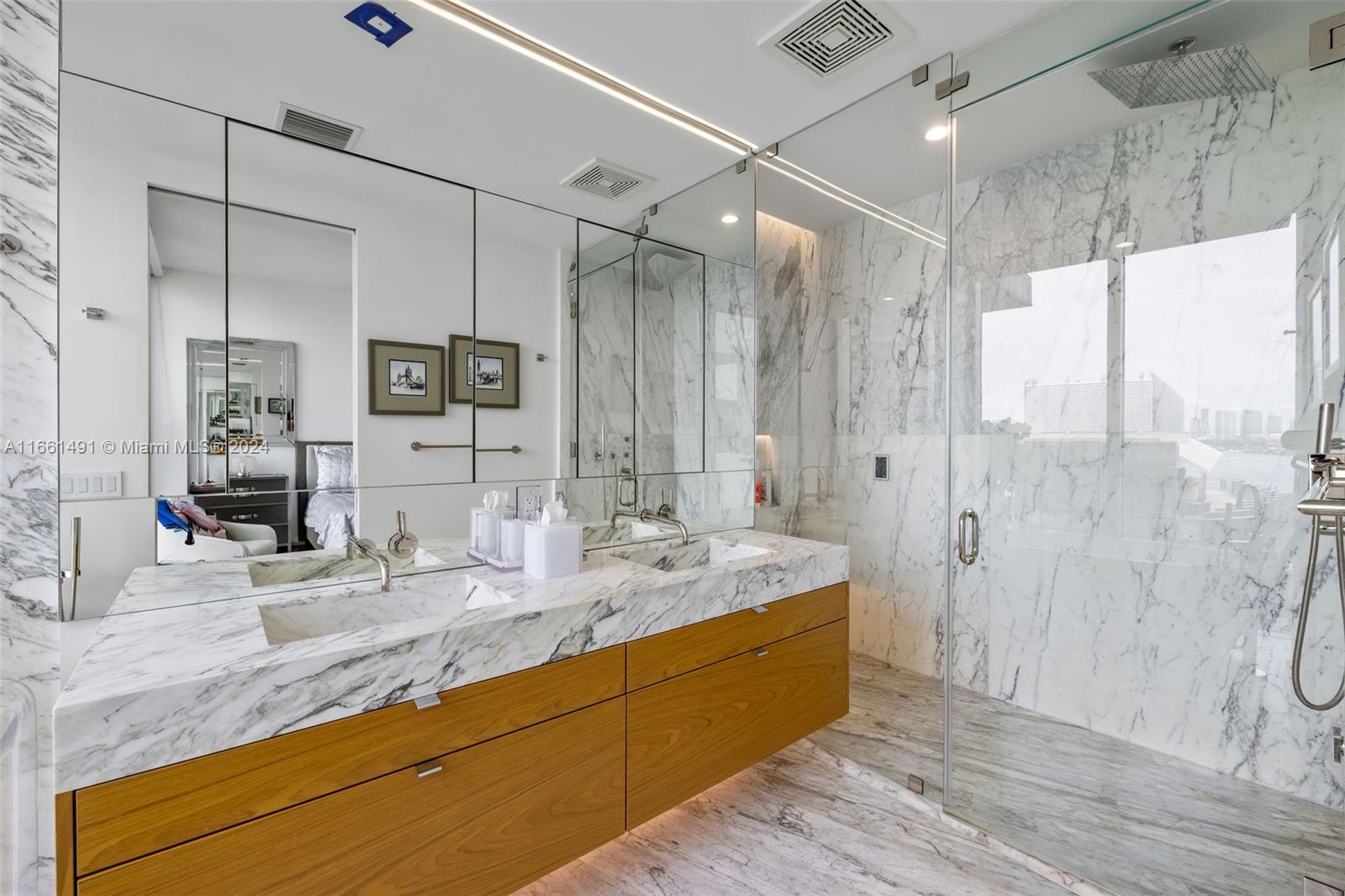 1300 Monad Terrace, Unit 9B Miami Beach, FL 33139 - Photo 9 of 34 a bathroom with a double vanity sink mirror double and shower