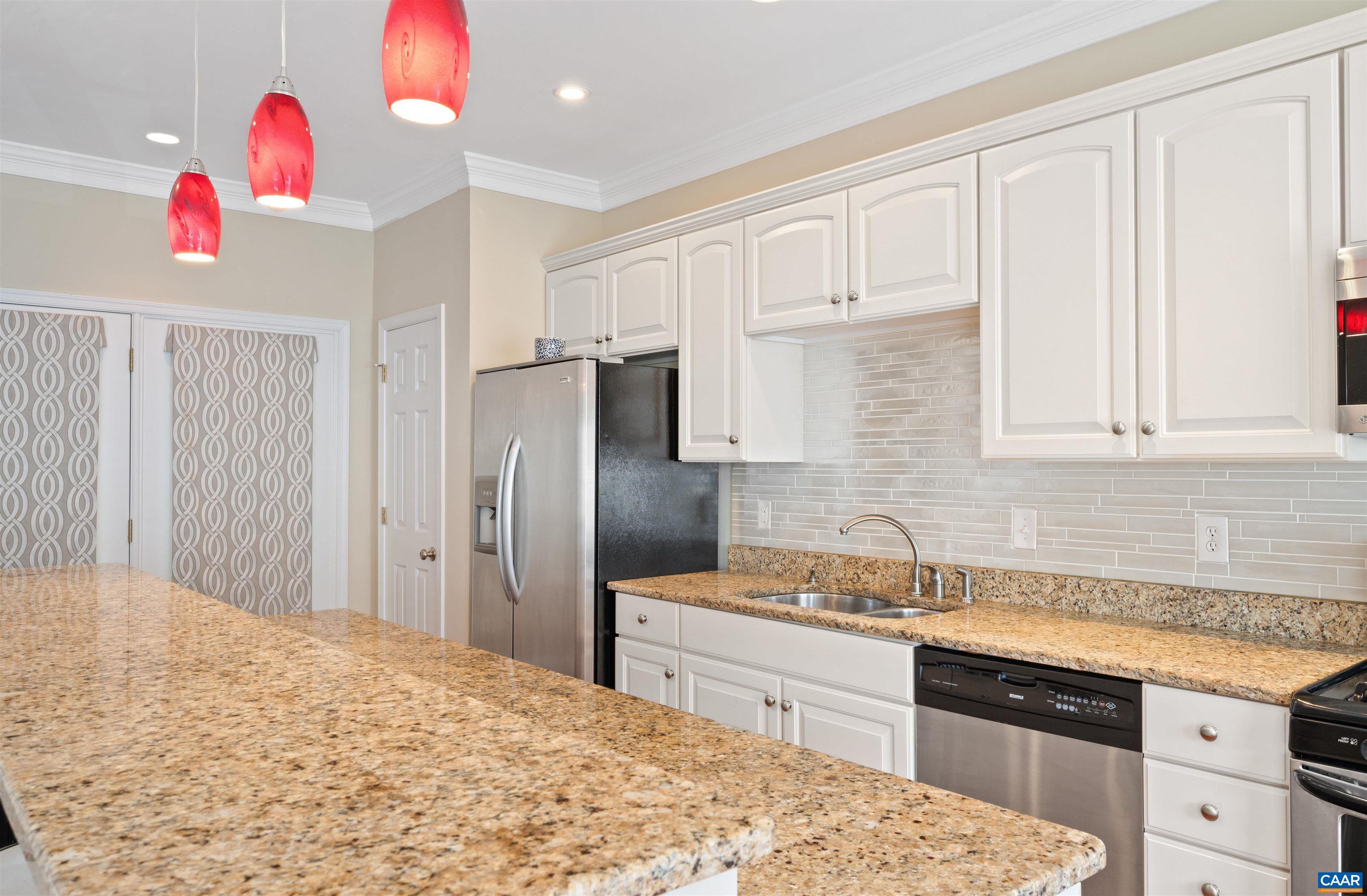 371 Quarry Road Charlottesville, VA 22902 - Photo 11 of 52 a kitchen with a sink refrigerator and cabinets