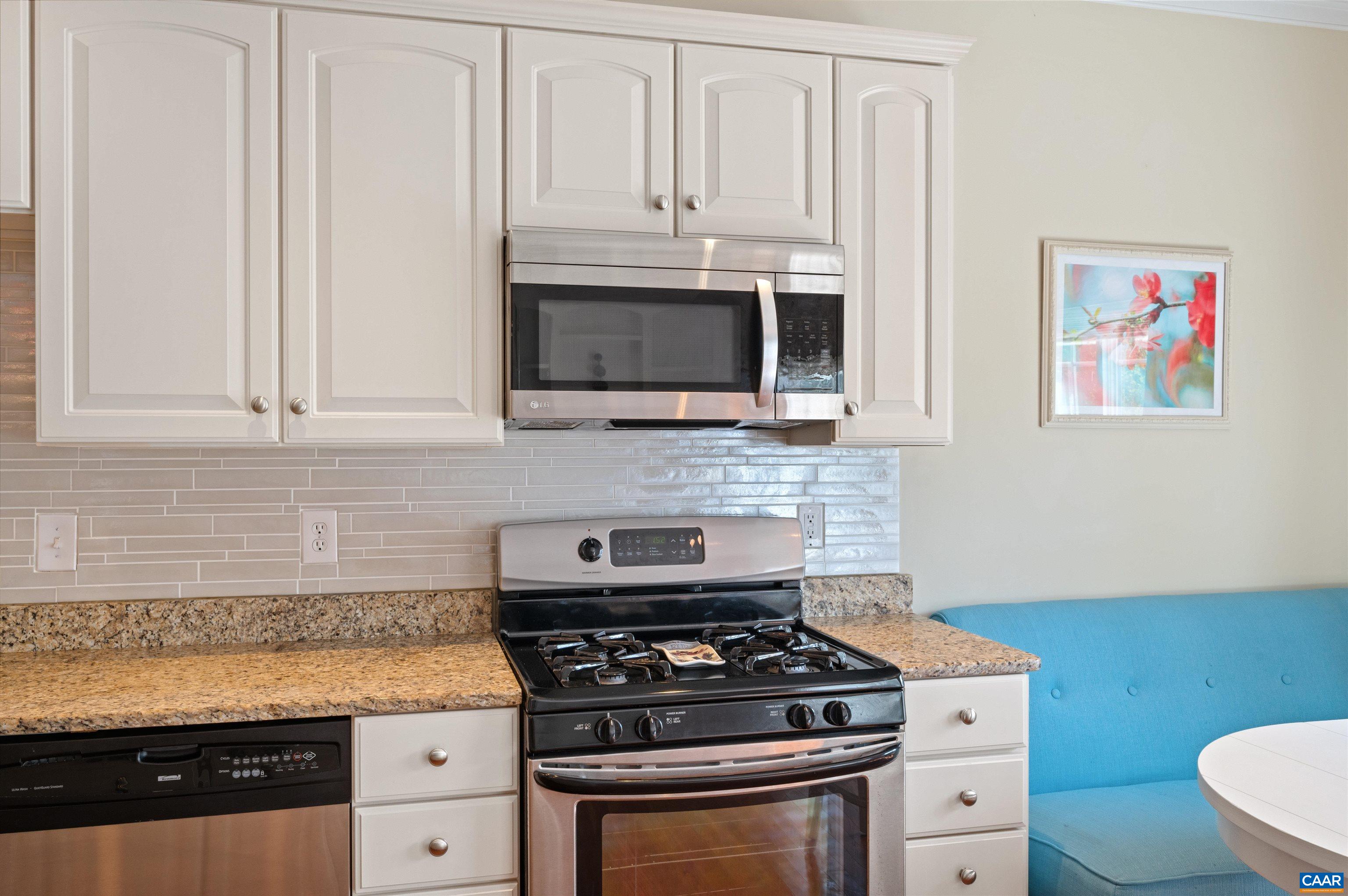 371 Quarry Road Charlottesville, VA 22902 - Photo 13 of 52 a kitchen with granite countertop white cabinets and stainless steel appliances