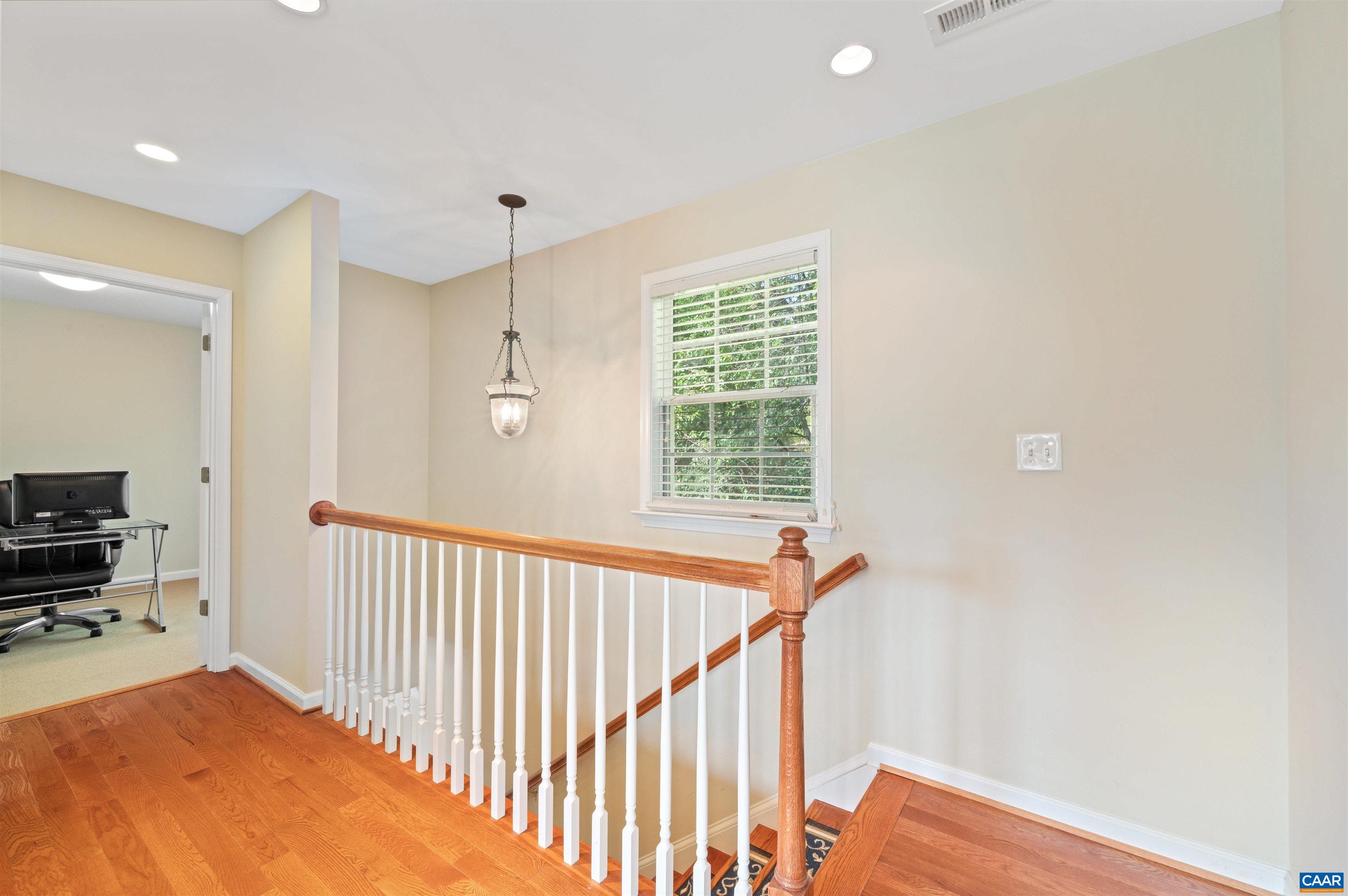 371 Quarry Road Charlottesville, VA 22902 - Photo 18 of 52 a view of a hallway with workspace and a window