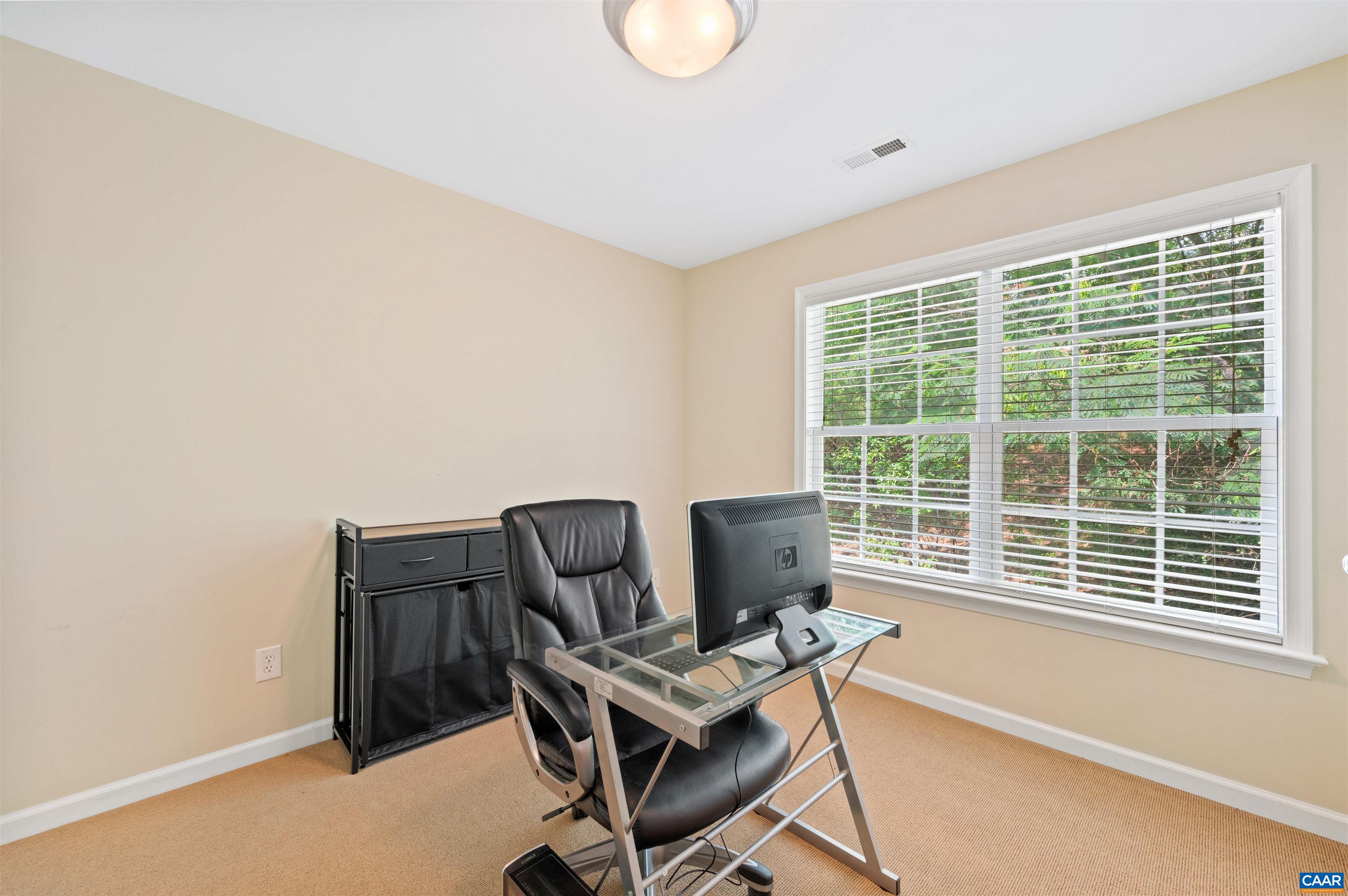 371 Quarry Road Charlottesville, VA 22902 - Photo 24 of 52 a view of a workspace with furniture and a window