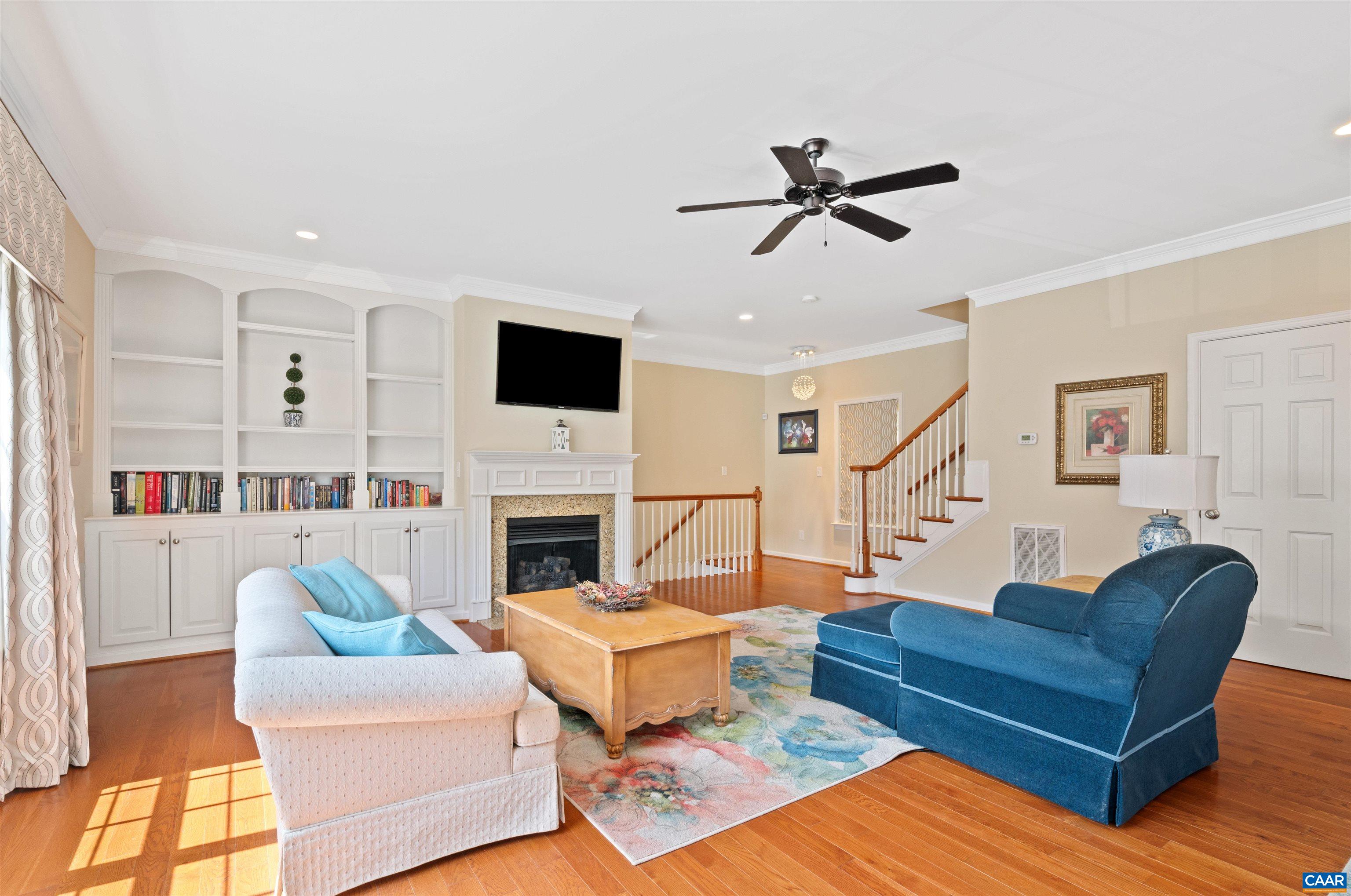 371 Quarry Road Charlottesville, VA 22902 - Photo 3 of 52 a living room with furniture a fireplace and a flat screen tv