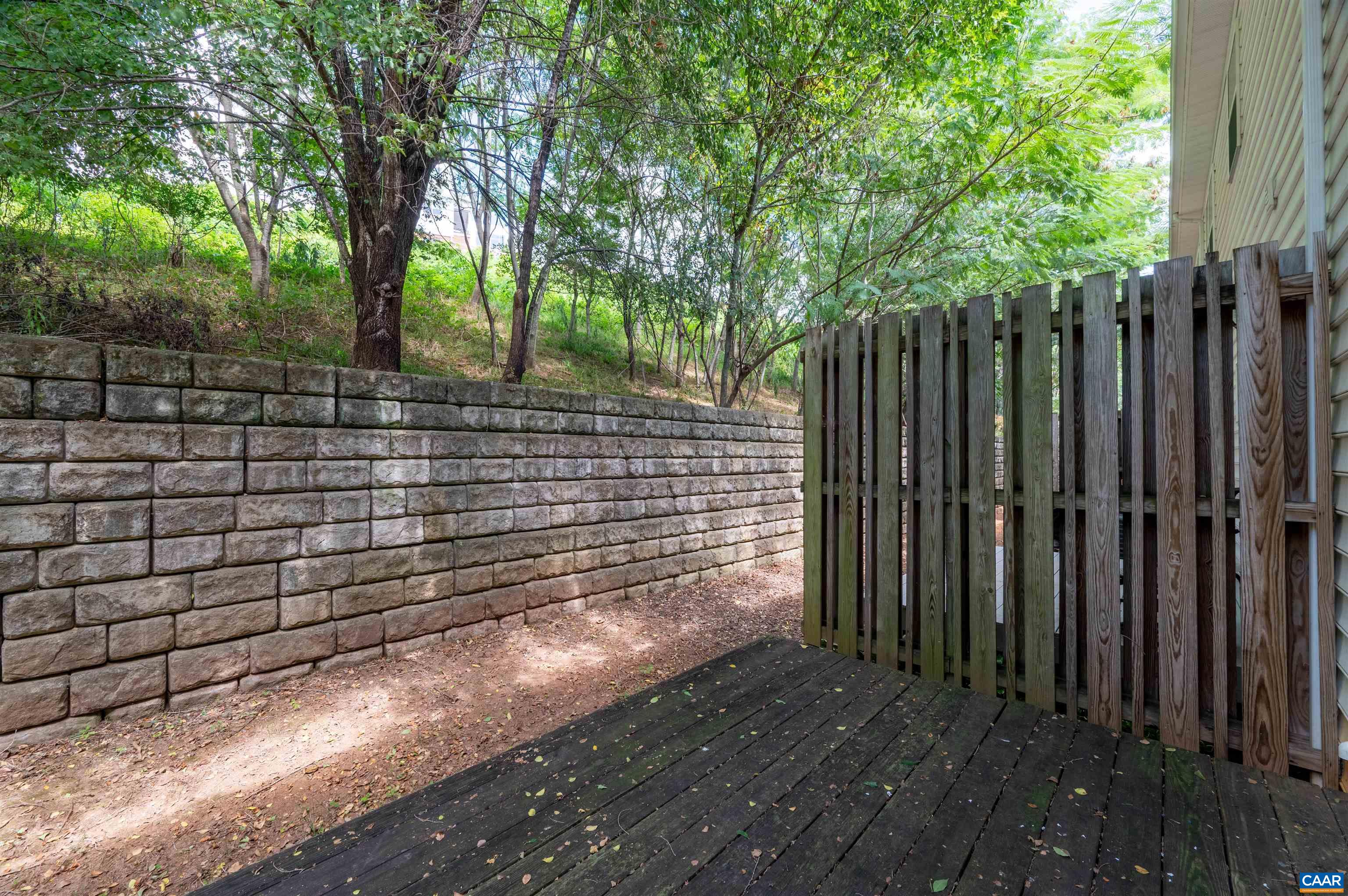 371 Quarry Road Charlottesville, VA 22902 - Photo 39 of 52 a view of a backyard with trees and wooden fence
