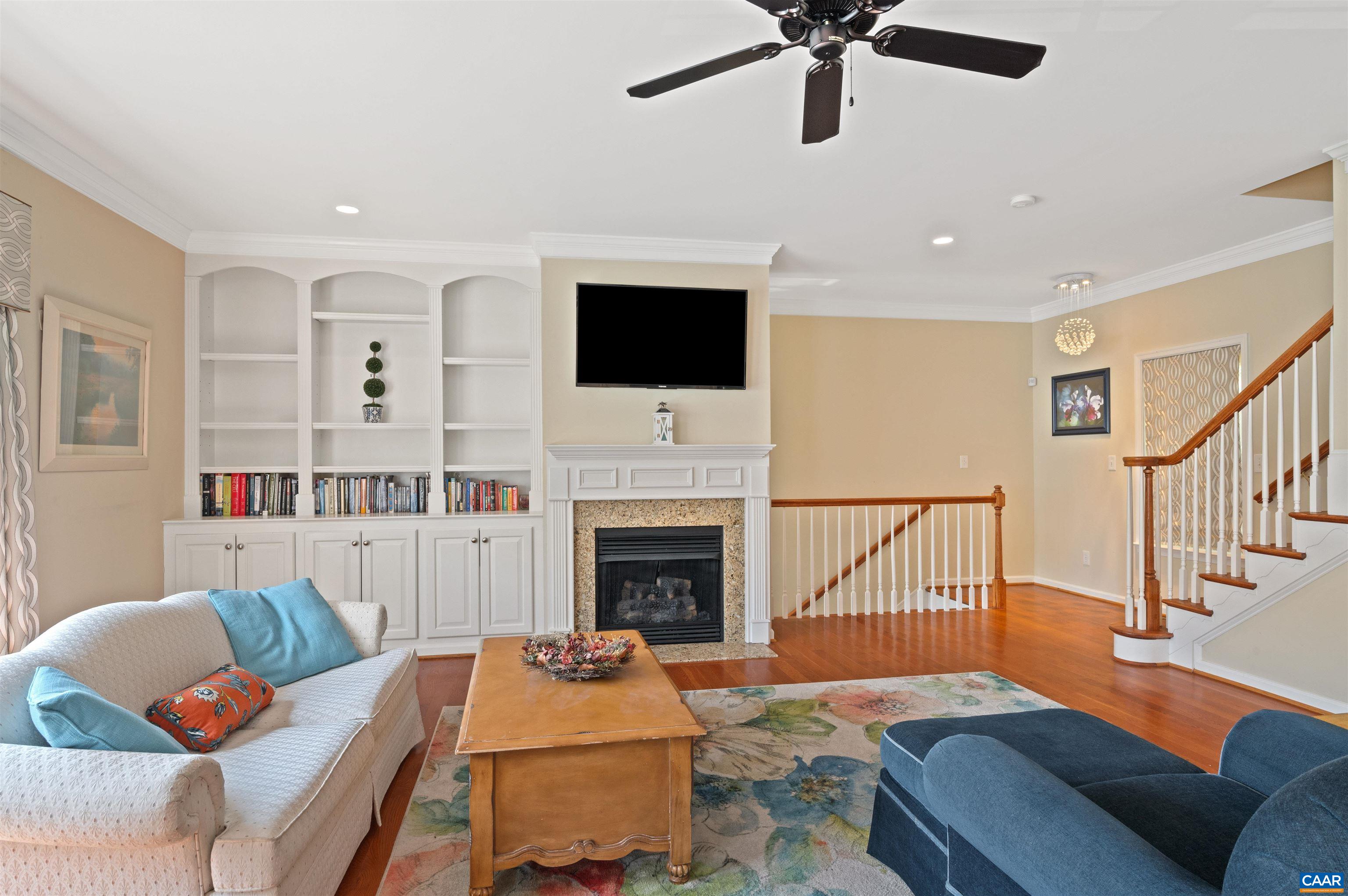 371 Quarry Road Charlottesville, VA 22902 - Photo 4 of 52 a living room with furniture fireplace and a flat screen tv