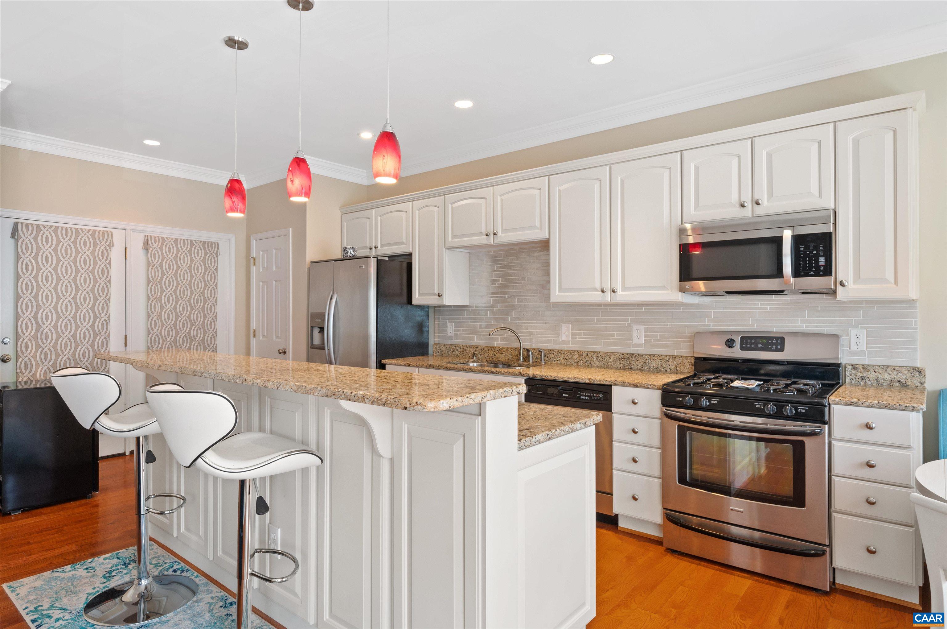 371 Quarry Road Charlottesville, VA 22902 - Photo 7 of 52 a kitchen that has a stove and a microwave