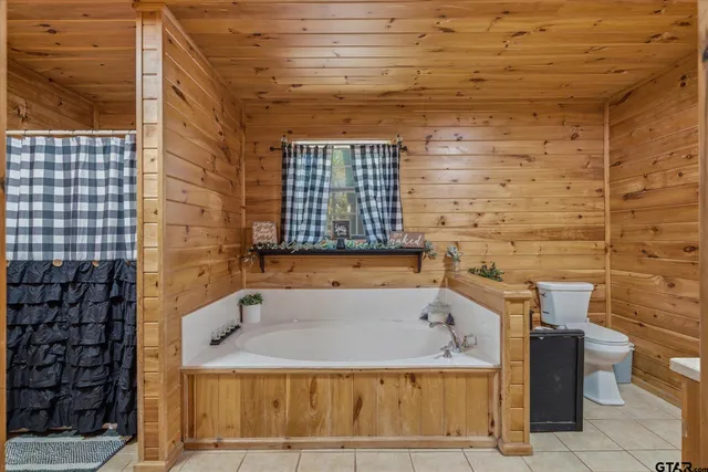 a bathroom with a bathtub and shower