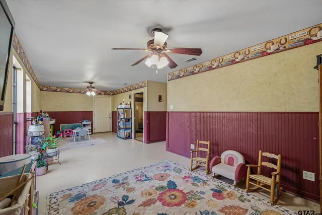 a bedroom with furniture and a chandelier