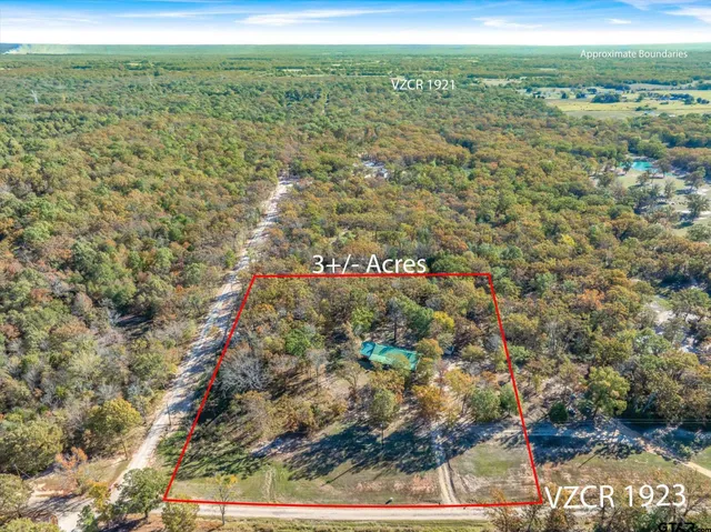 a view of a field with an outdoor space