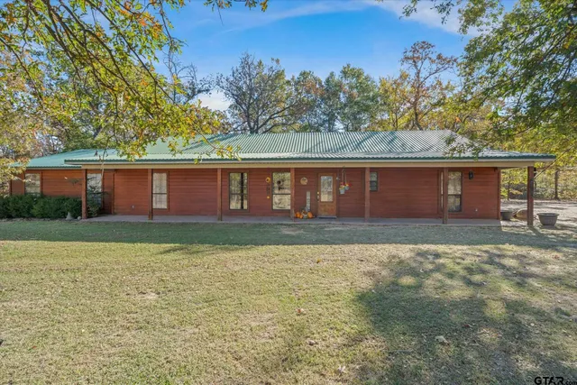 a view of backyard with green space