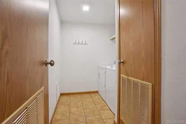 a view of an empty room with closet area