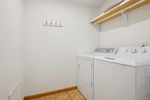 a bathroom with a toilet a sink and a mirror