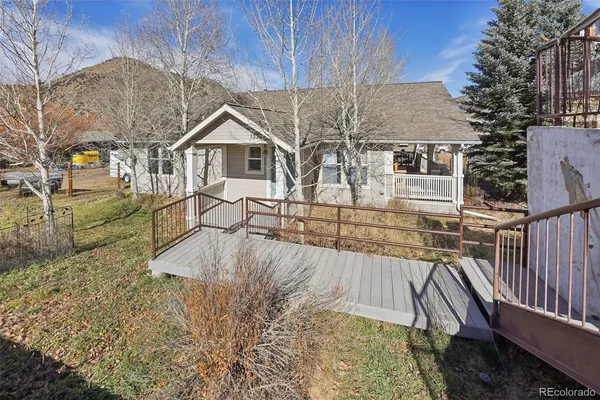 a view of a house with wooden deck