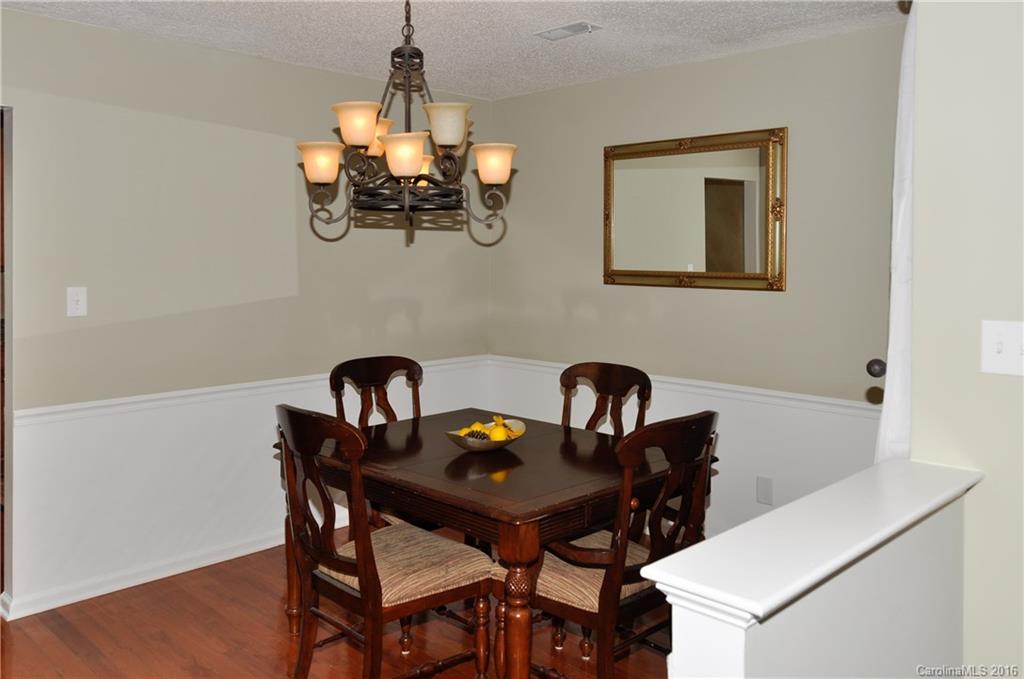 9924 Fairway Ridge Road Charlotte, NC 28277 - Photo 2 of 21 a dining room with a table and chairs