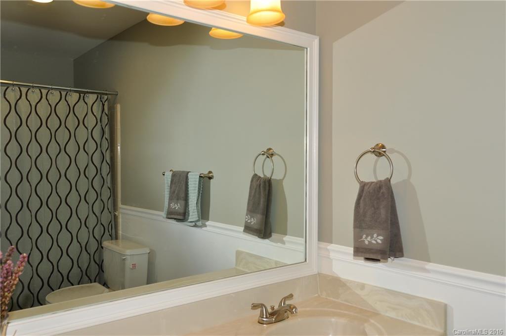 9924 Fairway Ridge Road Charlotte, NC 28277 - Photo 11 of 21 a bathroom with a sink and mirror