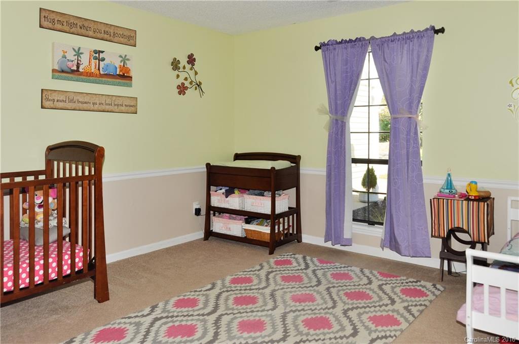 9924 Fairway Ridge Road Charlotte, NC 28277 - Photo 12 of 21 a bedroom with a bed and a window
