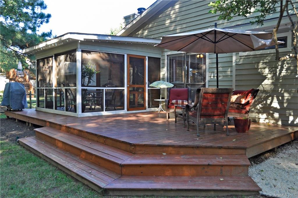 9924 Fairway Ridge Road Charlotte, NC 28277 - Photo 17 of 21 a backyard of a house with barbeque oven table and chairs