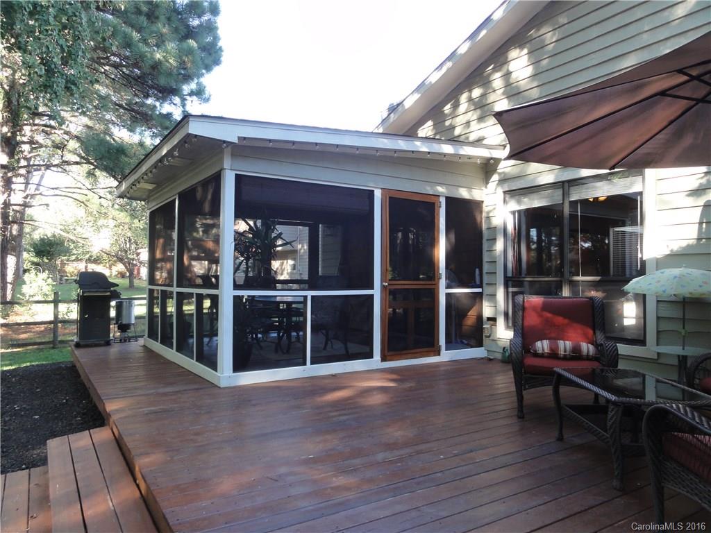 9924 Fairway Ridge Road Charlotte, NC 28277 - Photo 18 of 21 a view of a house with wooden deck and furniture