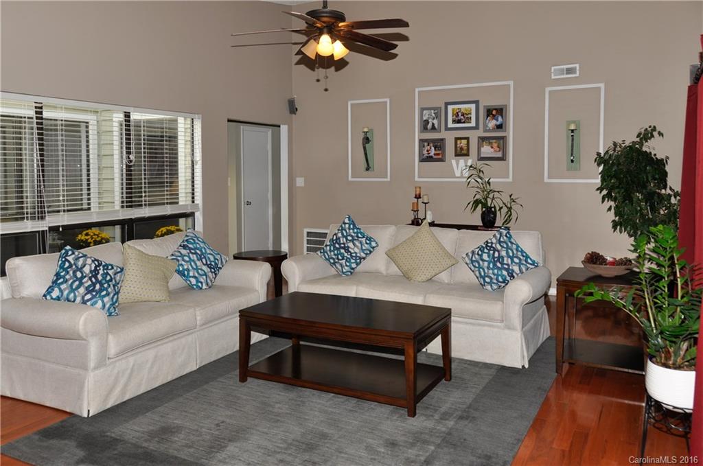 9924 Fairway Ridge Road Charlotte, NC 28277 - Photo 8 of 21 a living room with furniture potted plant and a window