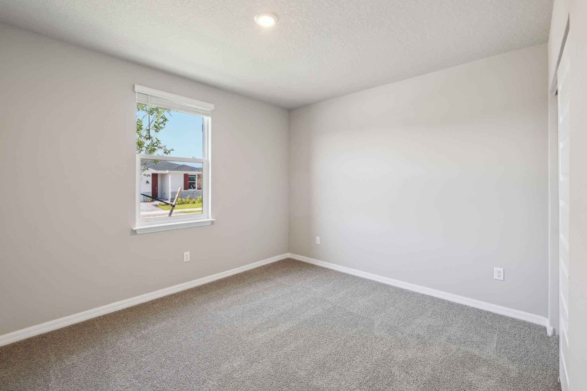 5413 Hampton Park Circle Vero Beach, FL 32966 - Photo 15 of 39 an empty room with windows