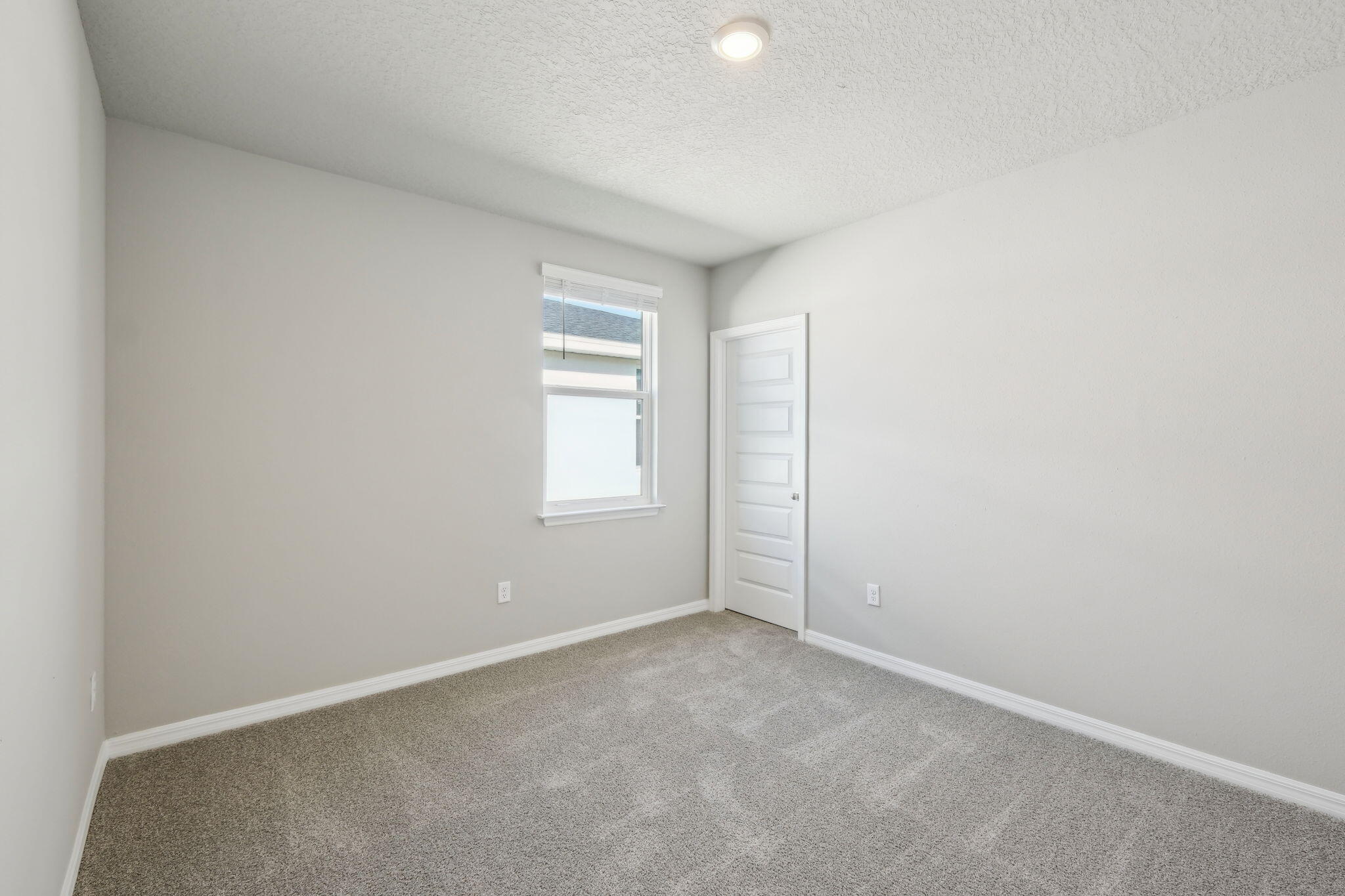 5413 Hampton Park Circle Vero Beach, FL 32966 - Photo 18 of 39 an empty room with windows