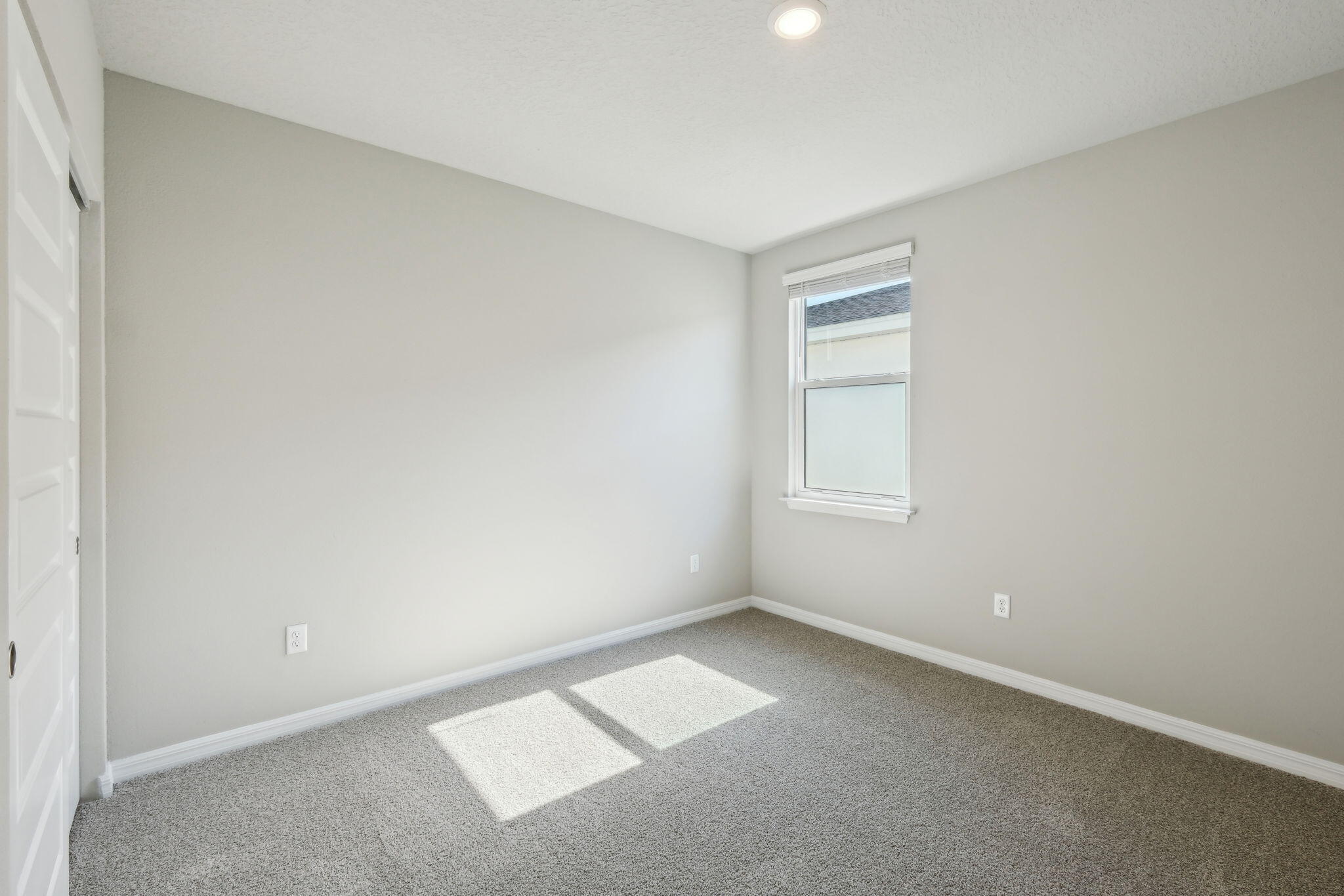 5413 Hampton Park Circle Vero Beach, FL 32966 - Photo 21 of 39 a view of an empty room with a window