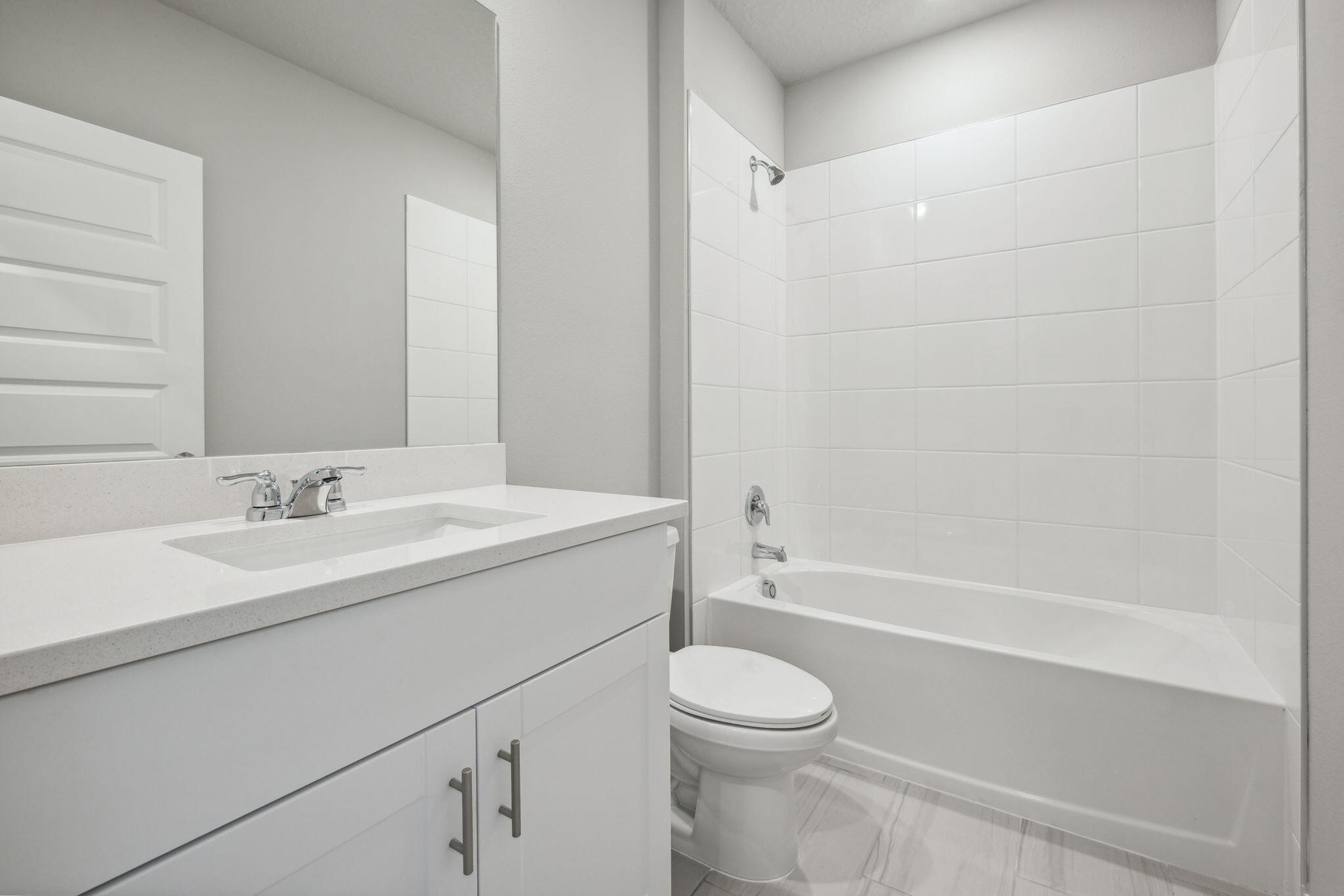 5413 Hampton Park Circle Vero Beach, FL 32966 - Photo 23 of 39 a bathroom with a granite countertop sink a toilet and shower