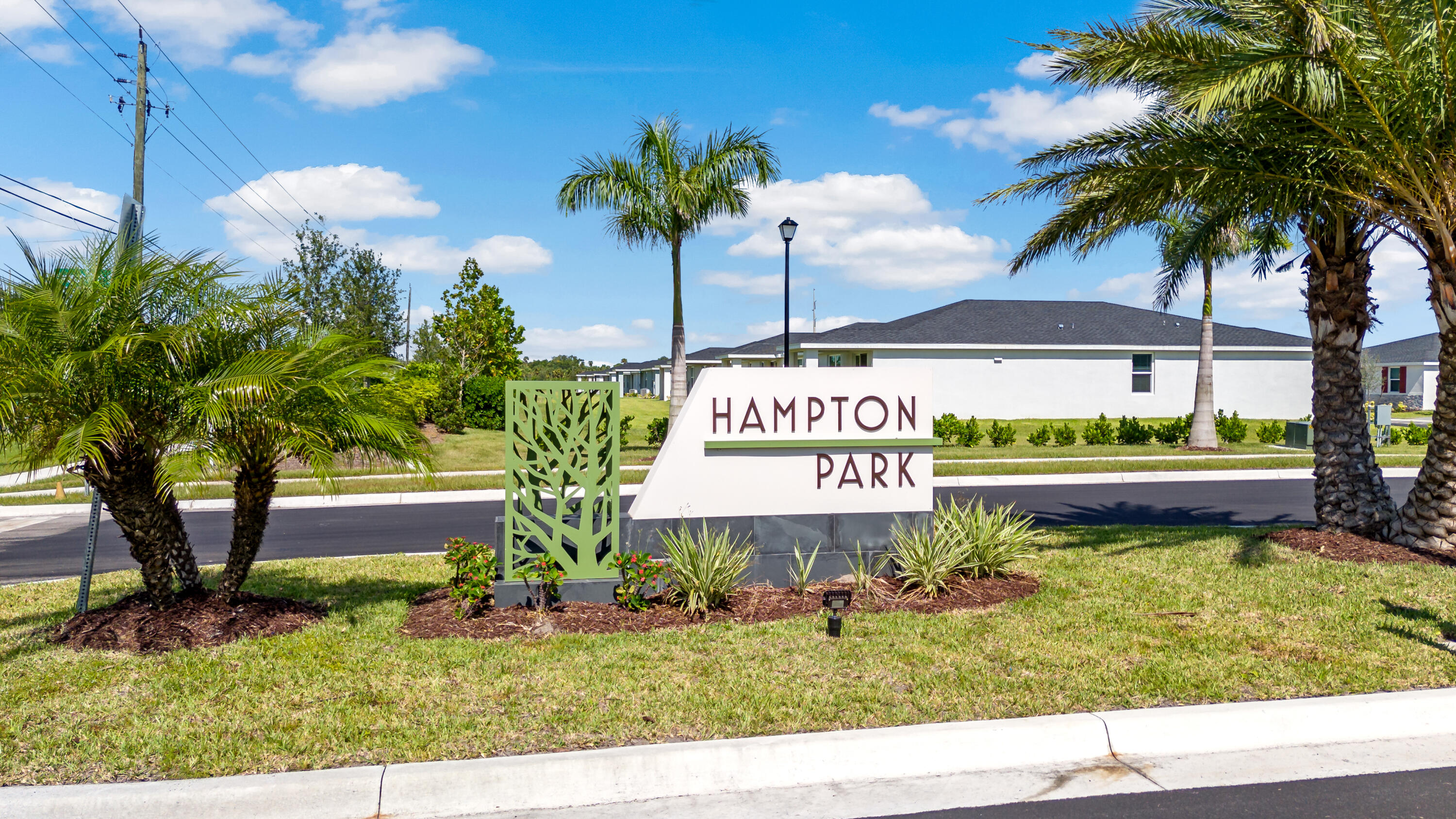 5413 Hampton Park Circle Vero Beach, FL 32966 - Photo 26 of 39 a sign on the side of the road