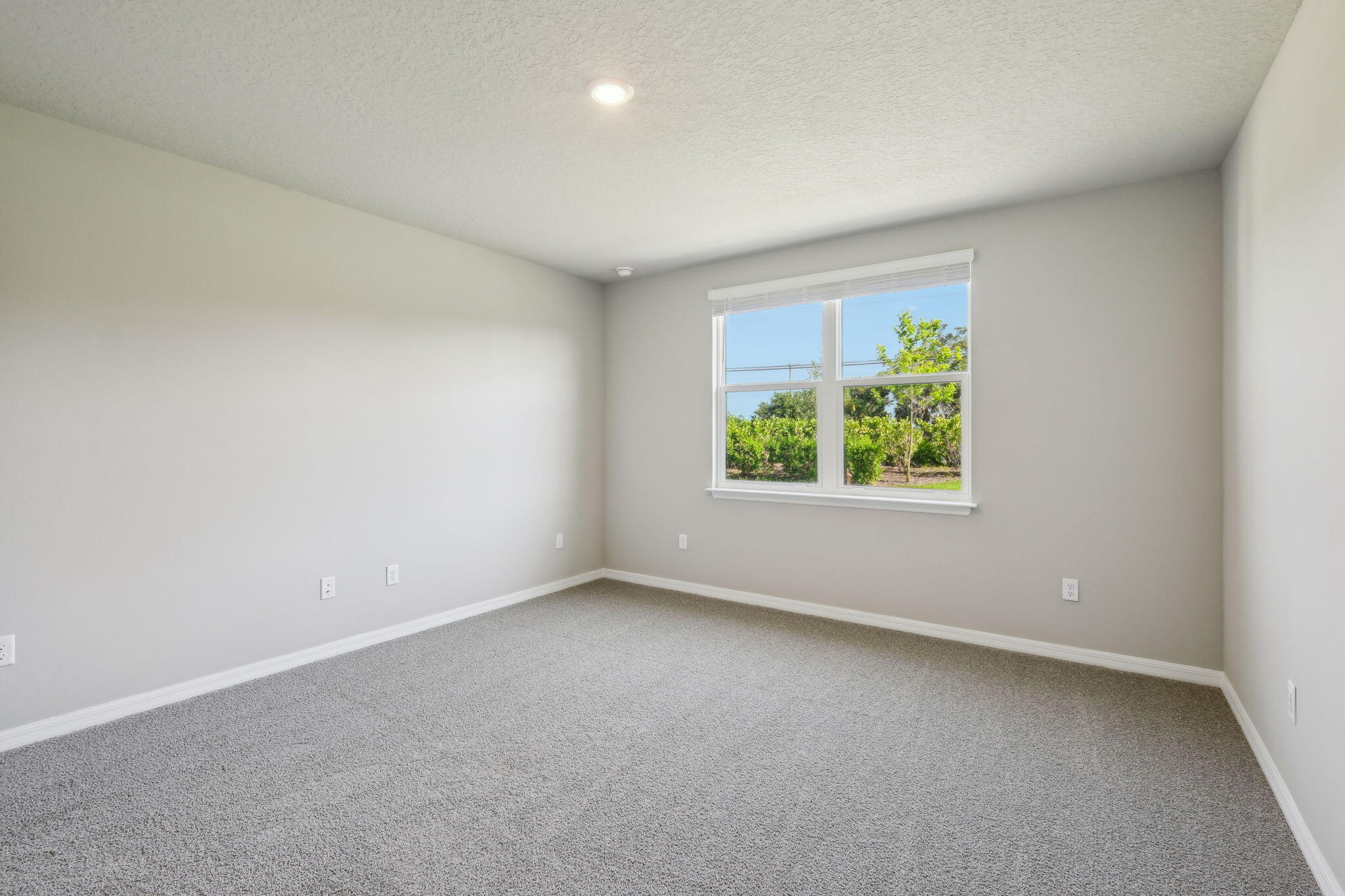 5413 Hampton Park Circle Vero Beach, FL 32966 - Photo 27 of 39 an empty room with windows