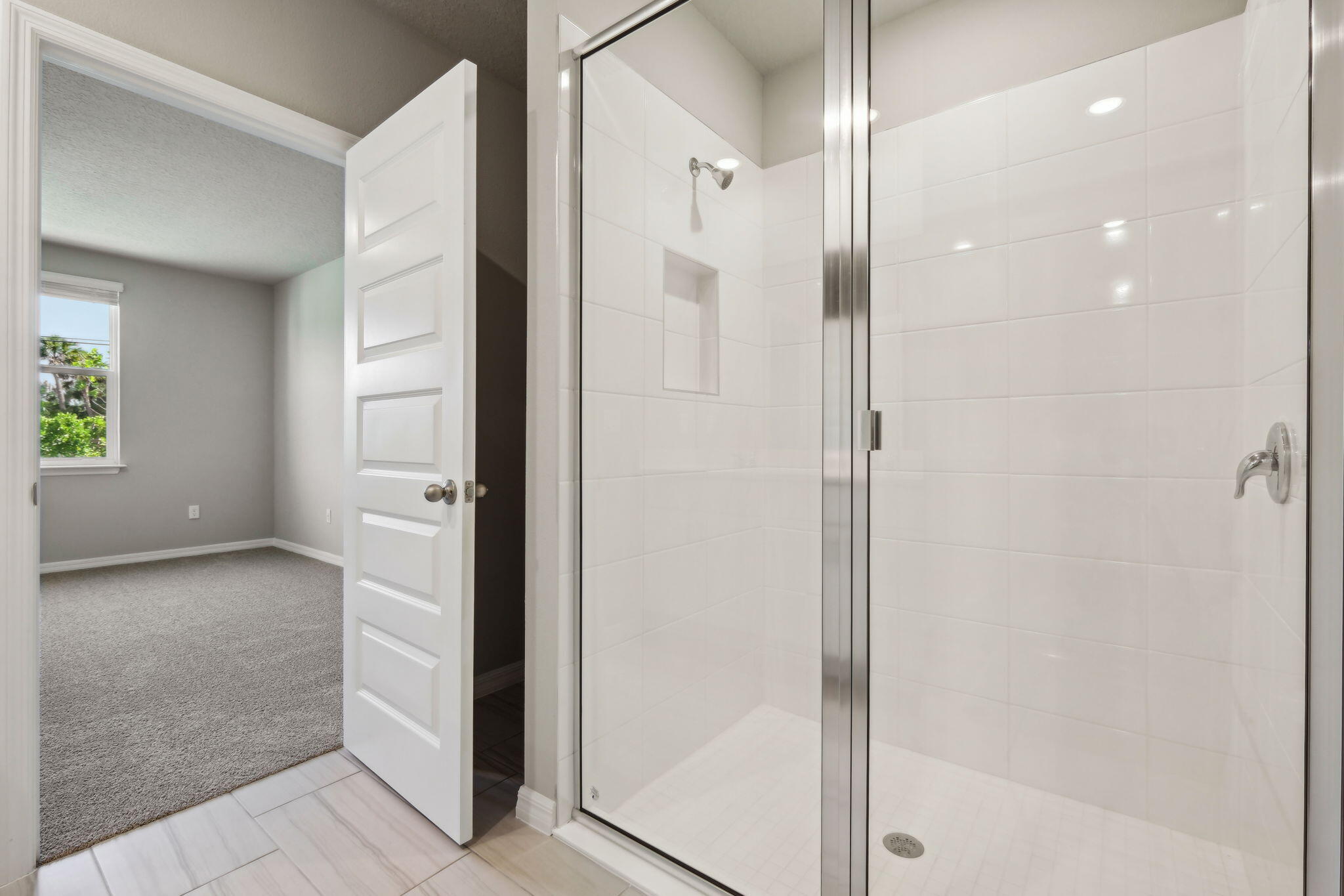 5413 Hampton Park Circle Vero Beach, FL 32966 - Photo 30 of 39 a bathroom with a glass shower door and a sink