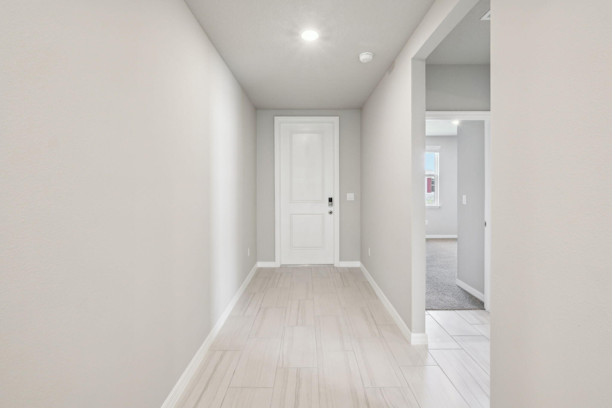 5413 Hampton Park Circle Vero Beach, FL 32966 - Photo 5 of 39 a view of a hallway with wooden floor