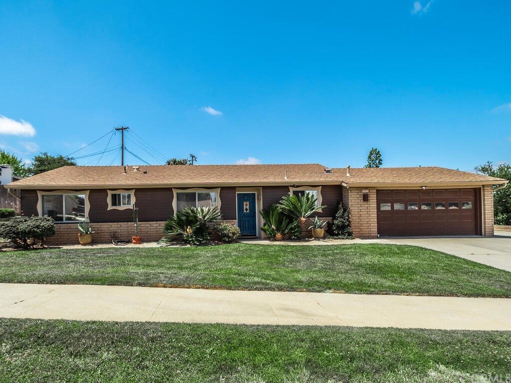 1286 Via Pavion Santa Maria, CA 93455 - Photo 1 of 38 a view of a big house with a big yard and potted plants
