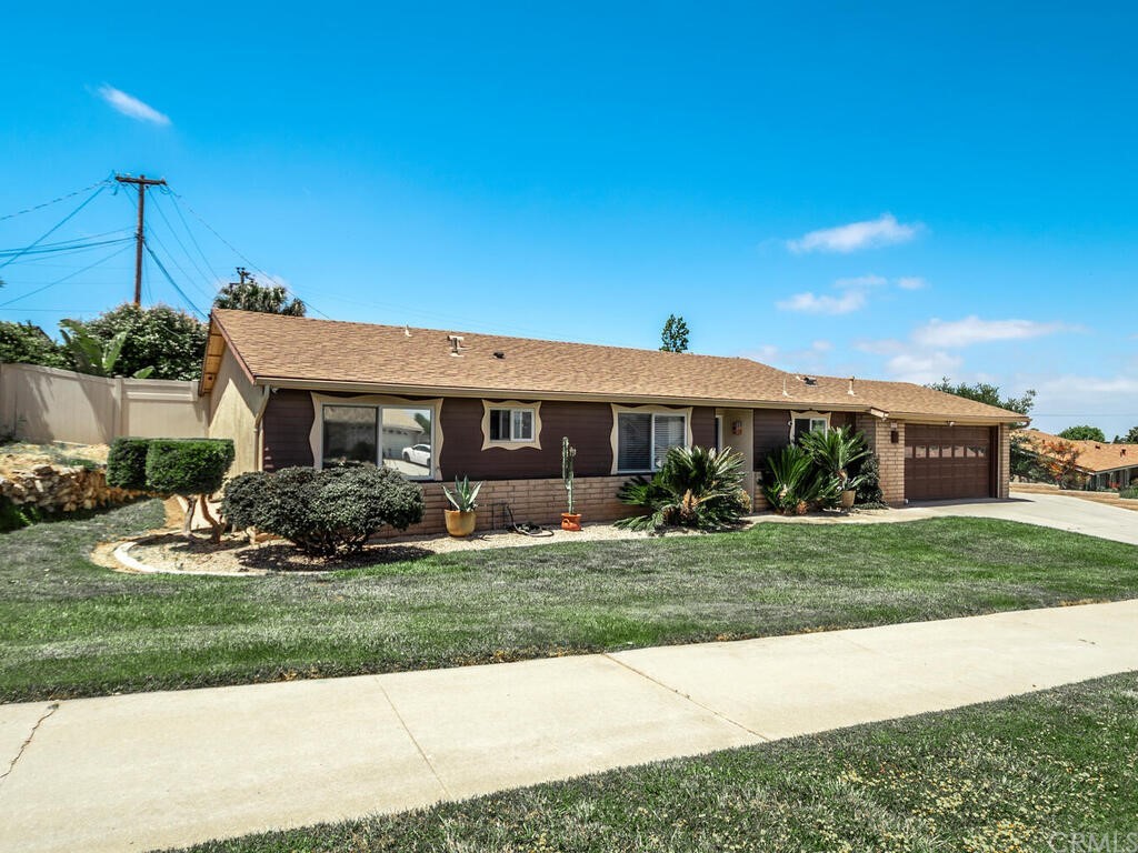 1286 Via Pavion Santa Maria, CA 93455 - Photo 2 of 38 a front view of a house with a yard