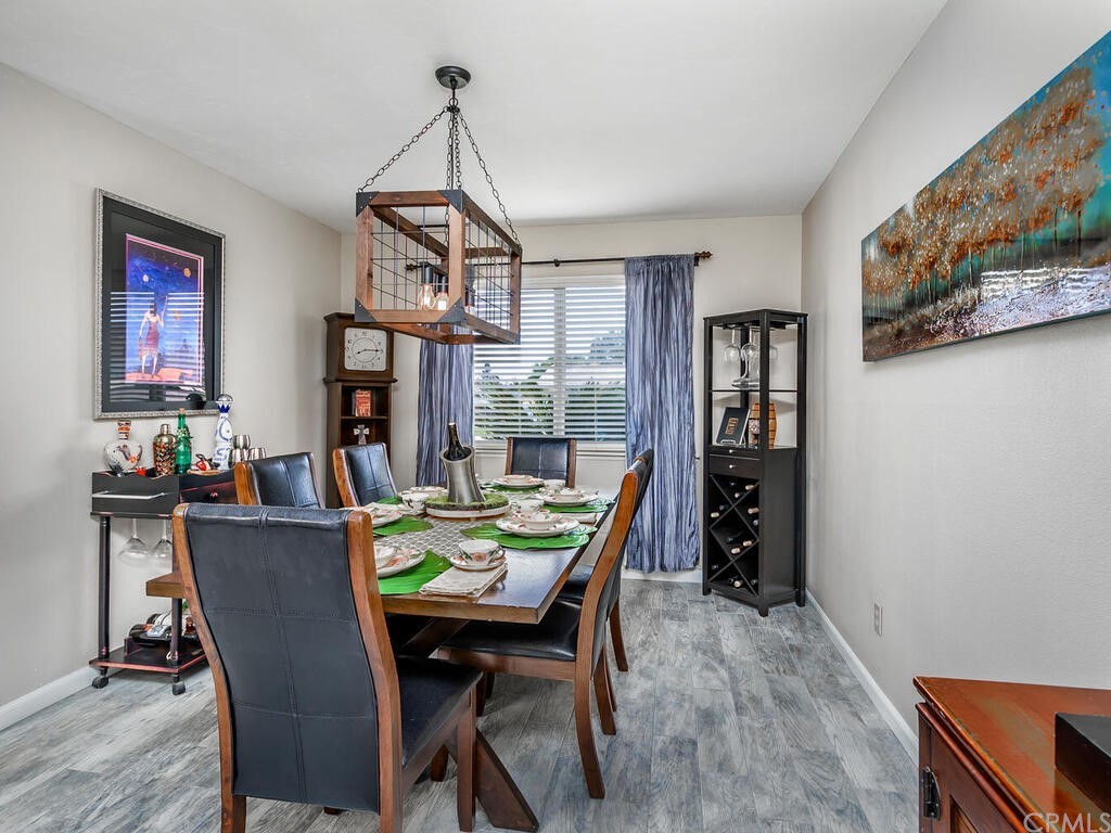 1286 Via Pavion Santa Maria, CA 93455 - Photo 12 of 38 a view of a dining room with furniture window and wooden floor