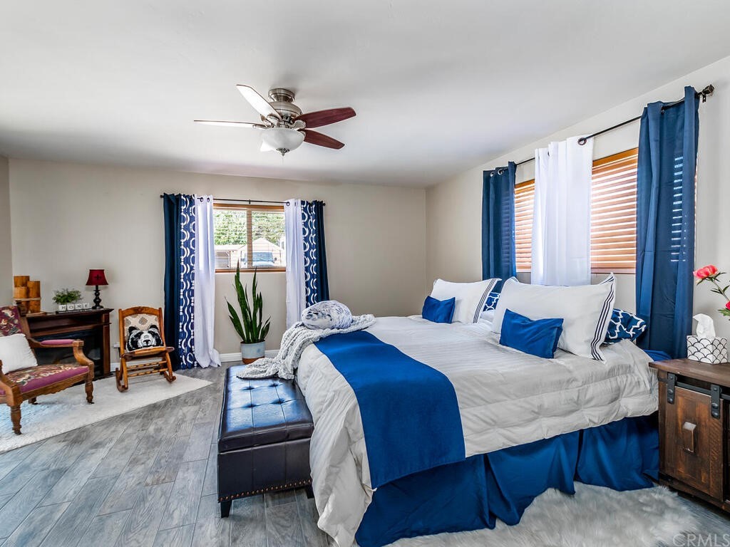 1286 Via Pavion Santa Maria, CA 93455 - Photo 13 of 38 a bedroom with a bed and a chandelier