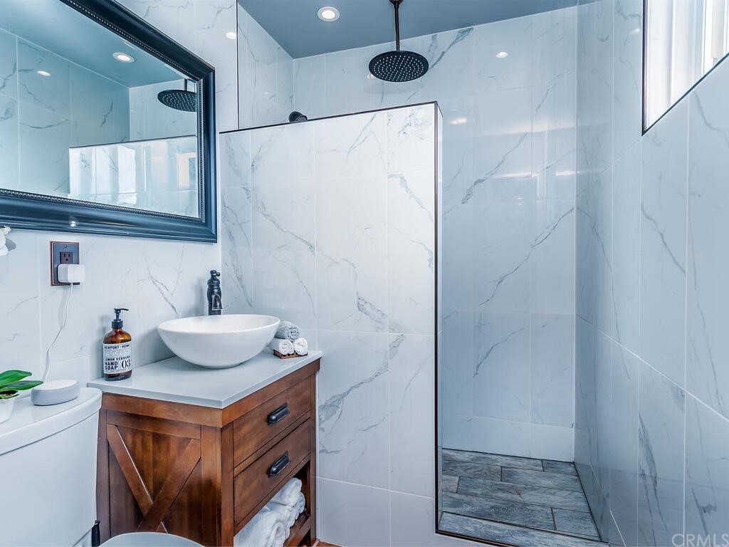 1286 Via Pavion Santa Maria, CA 93455 - Photo 19 of 38 a bathroom with a sink and a mirror