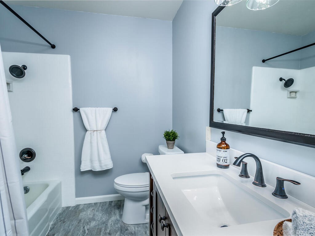 1286 Via Pavion Santa Maria, CA 93455 - Photo 22 of 38 a bathroom with a sink toilet and shower
