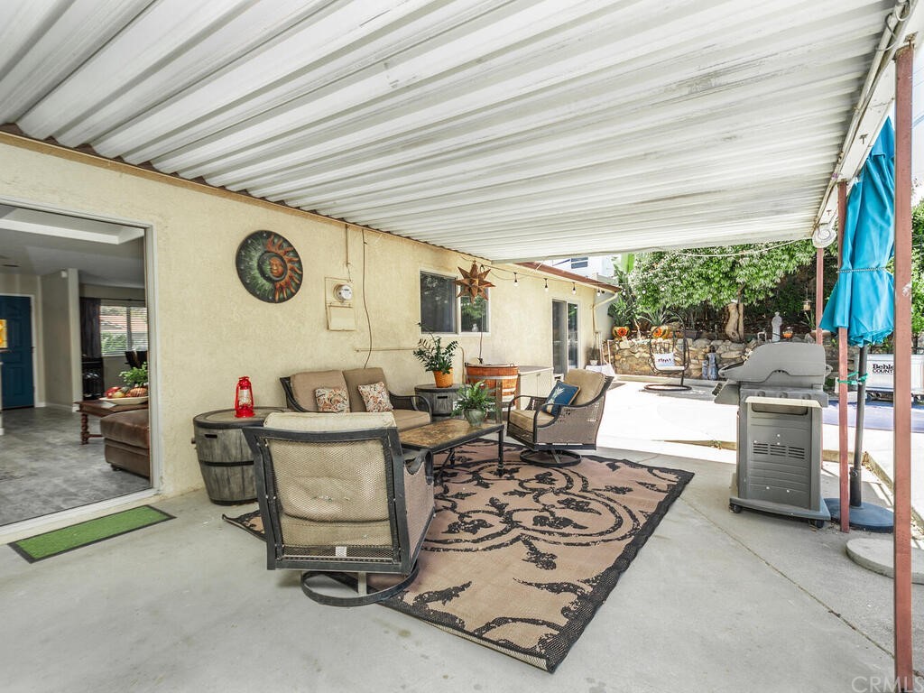 1286 Via Pavion Santa Maria, CA 93455 - Photo 24 of 38 a living room with furniture and a large window