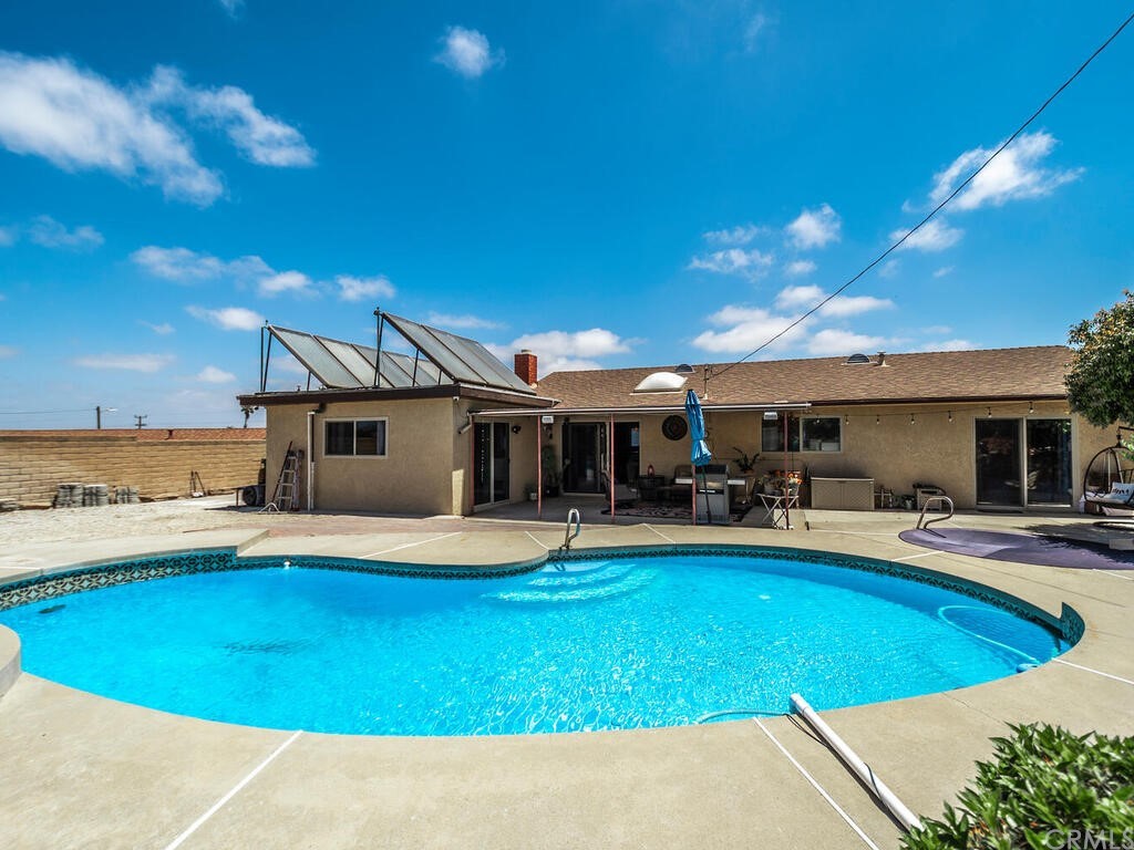 1286 Via Pavion Santa Maria, CA 93455 - Photo 29 of 38 a view of a swimming pool with lounge chairs