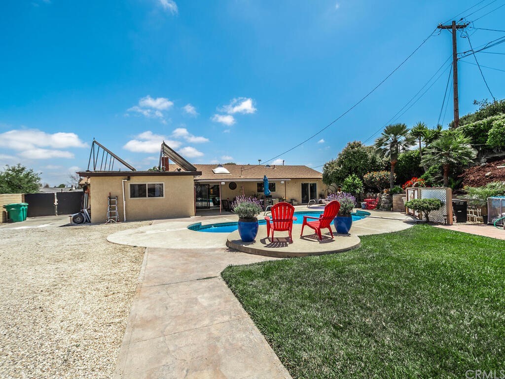 1286 Via Pavion Santa Maria, CA 93455 - Photo 32 of 38 a view of a house with backyard and sitting area