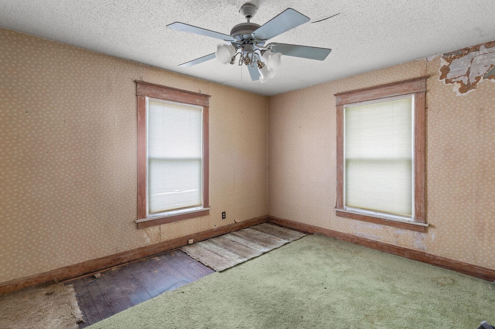 1721 28th Street Rock Island, IL 61201 - Photo 16 of 27 an empty room with windows and fan