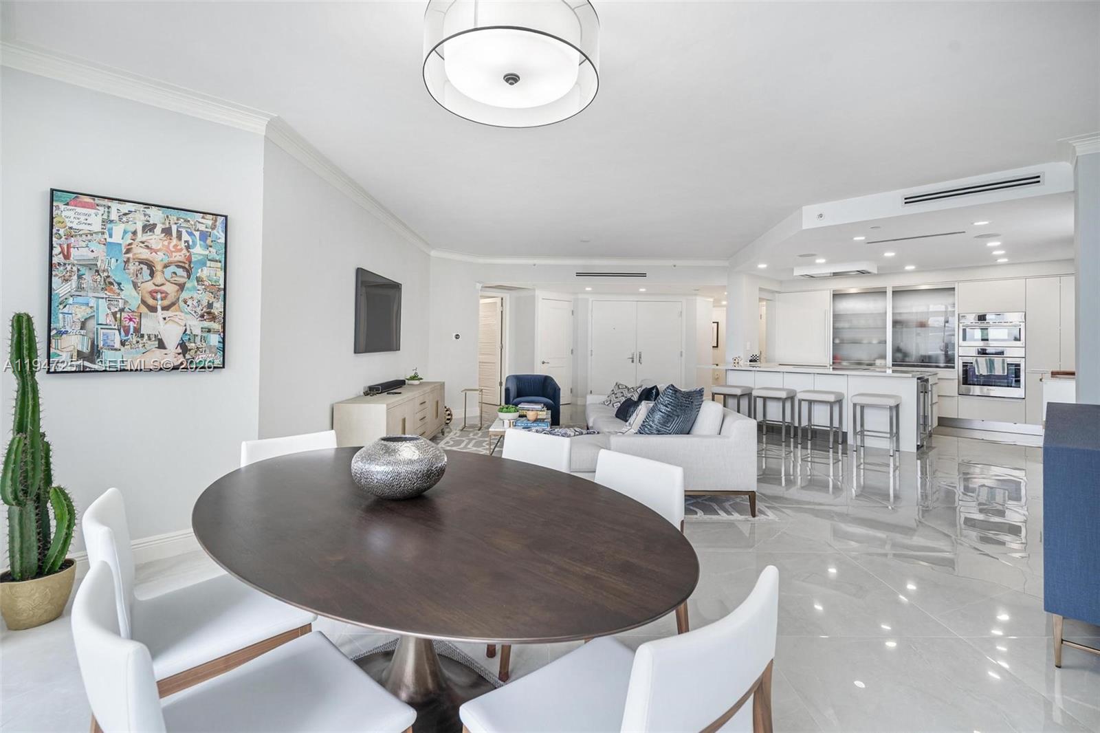 9559 Collins Avenue, Unit S4E Surfside, FL 33154 - Photo 13 of 37 a living room with furniture and a table