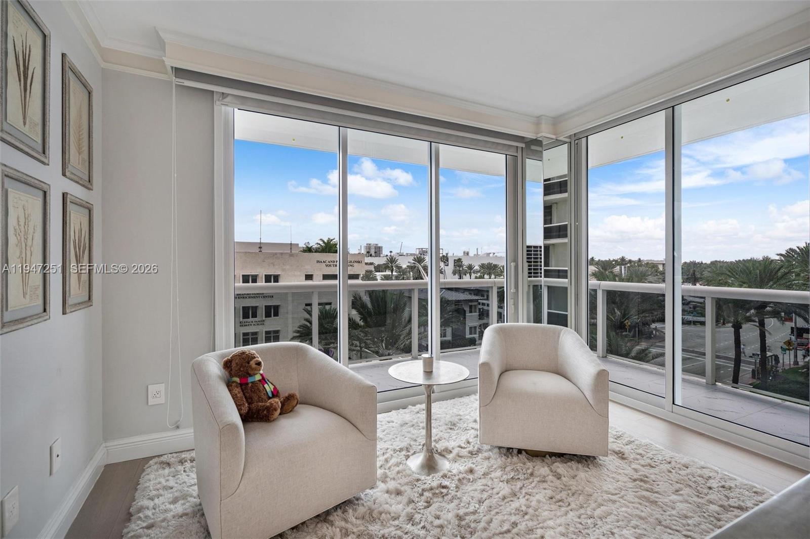 9559 Collins Avenue, Unit S4E Surfside, FL 33154 - Photo 17 of 37 a living room with furniture and a large window