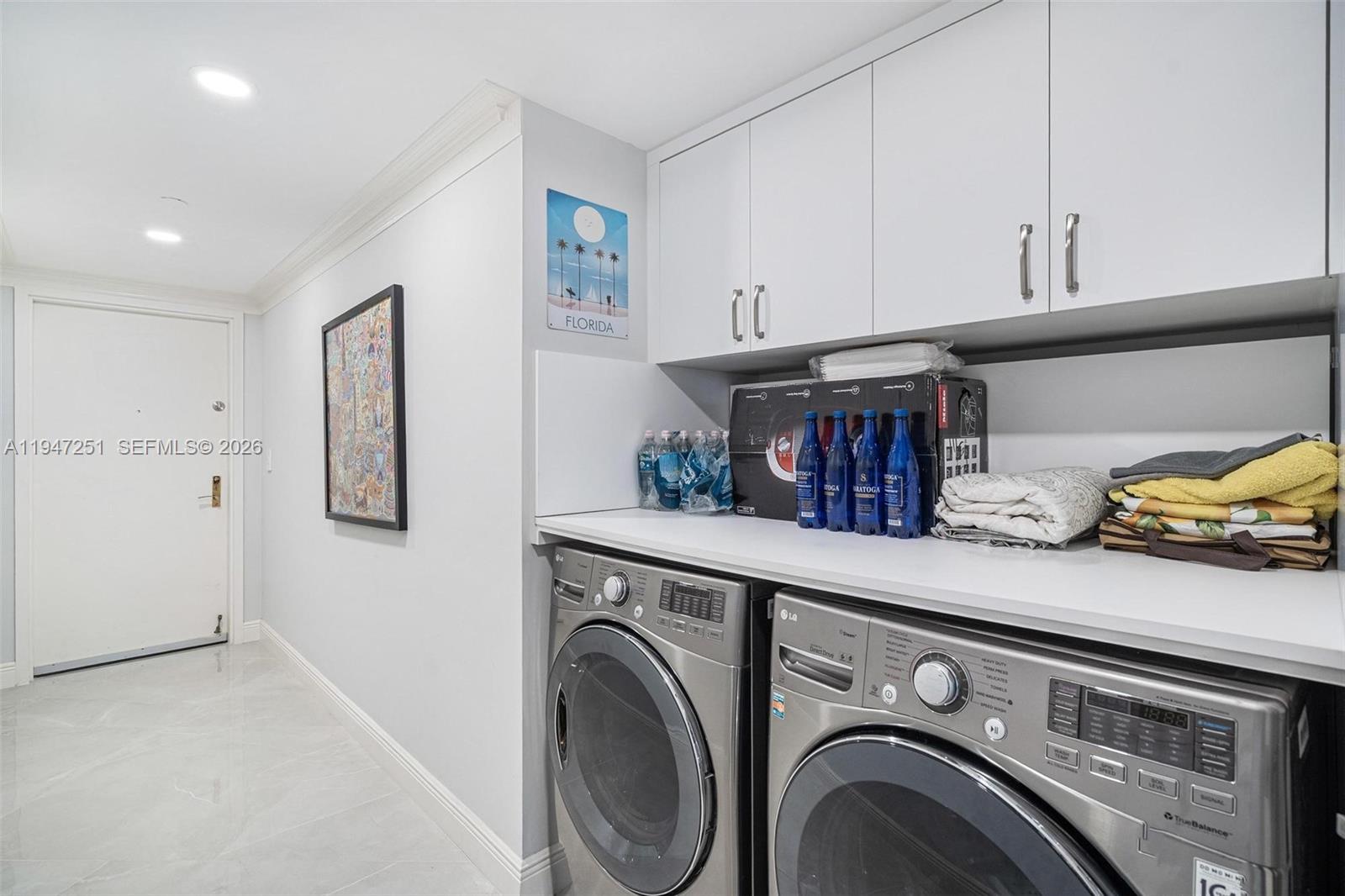 9559 Collins Avenue, Unit S4E Surfside, FL 33154 - Photo 28 of 37 a utility room with dryer and washer