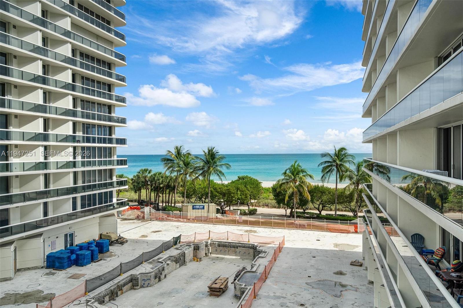 9559 Collins Avenue, Unit S4E Surfside, FL 33154 - Photo 36 of 37 a view of a swimming pool with a patio