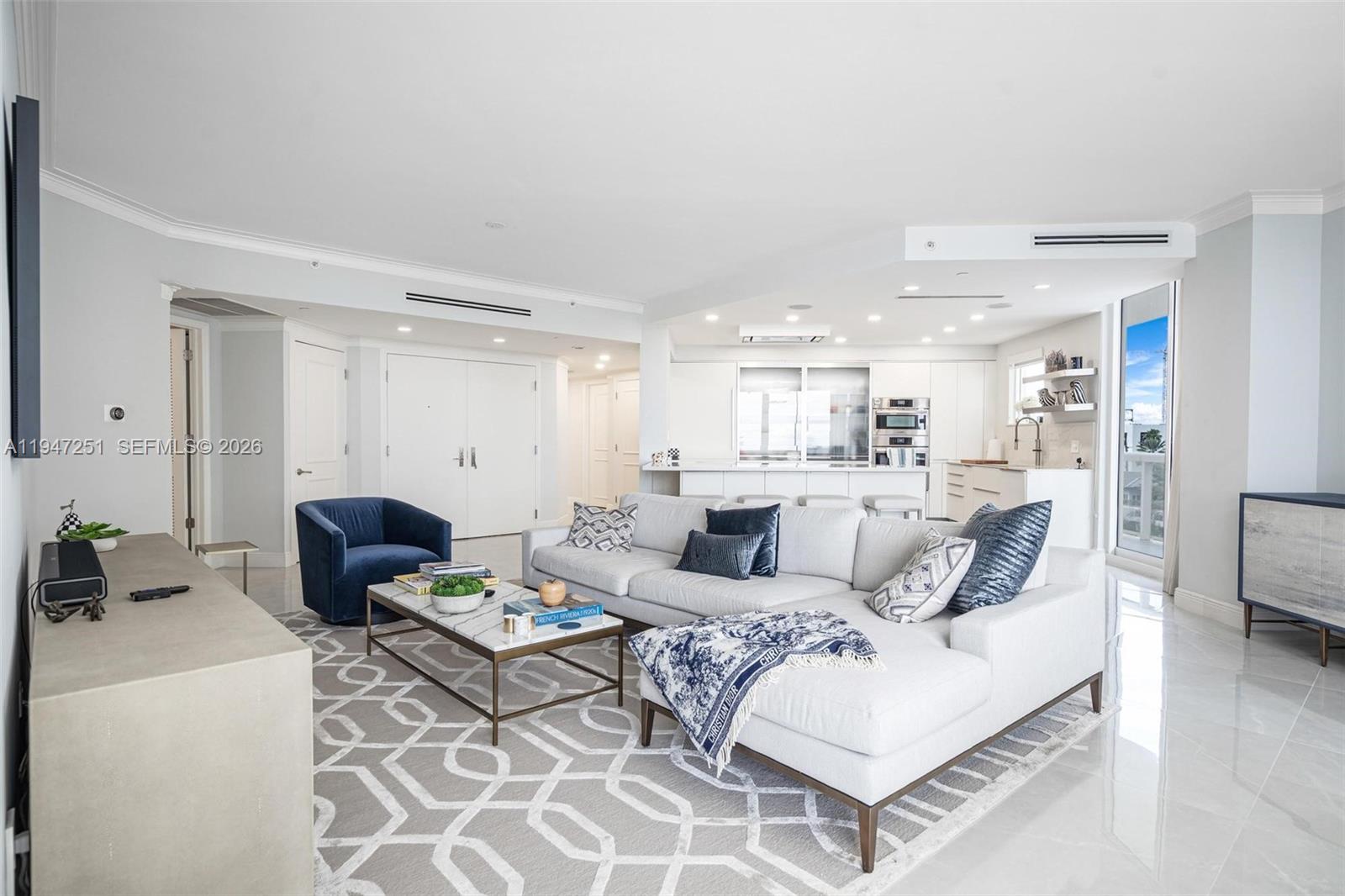 9559 Collins Avenue, Unit S4E Surfside, FL 33154 - Photo 4 of 37 a living room with furniture kitchen view and a table