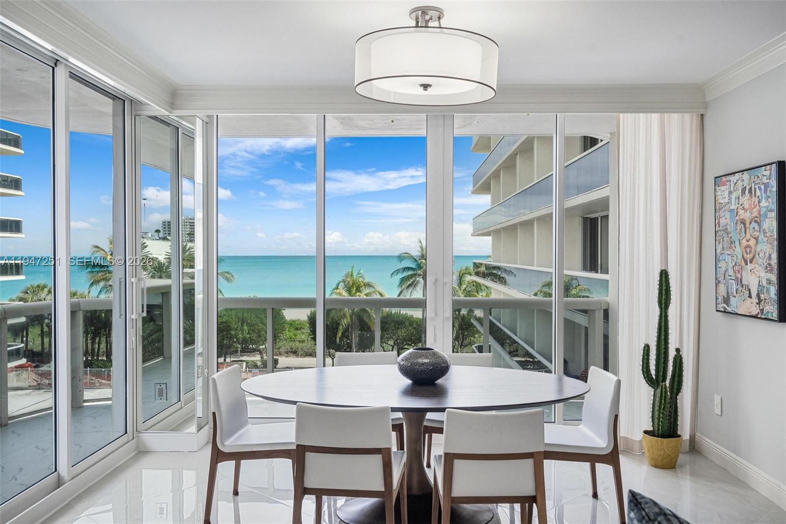 9559 Collins Avenue, Unit S4E Surfside, FL 33154 - Photo 6 of 37 a view of a dining room with furniture window and outside view