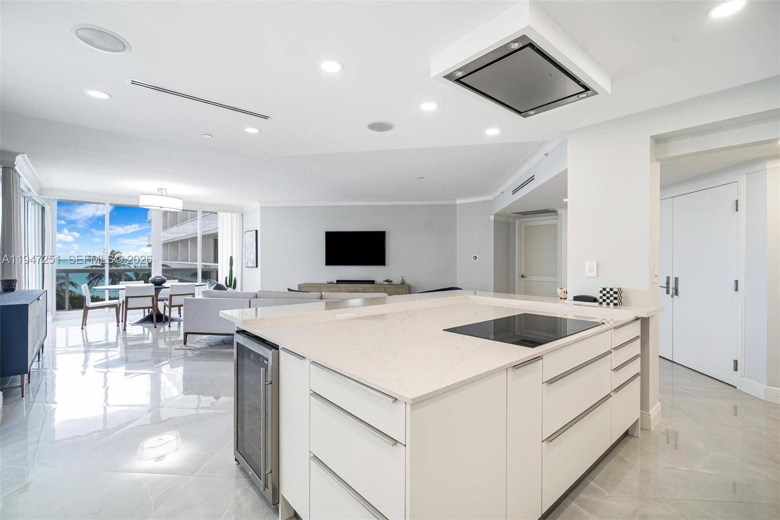 9559 Collins Avenue, Unit S4E Surfside, FL 33154 - Photo 9 of 37 a kitchen with a stove and a refrigerator