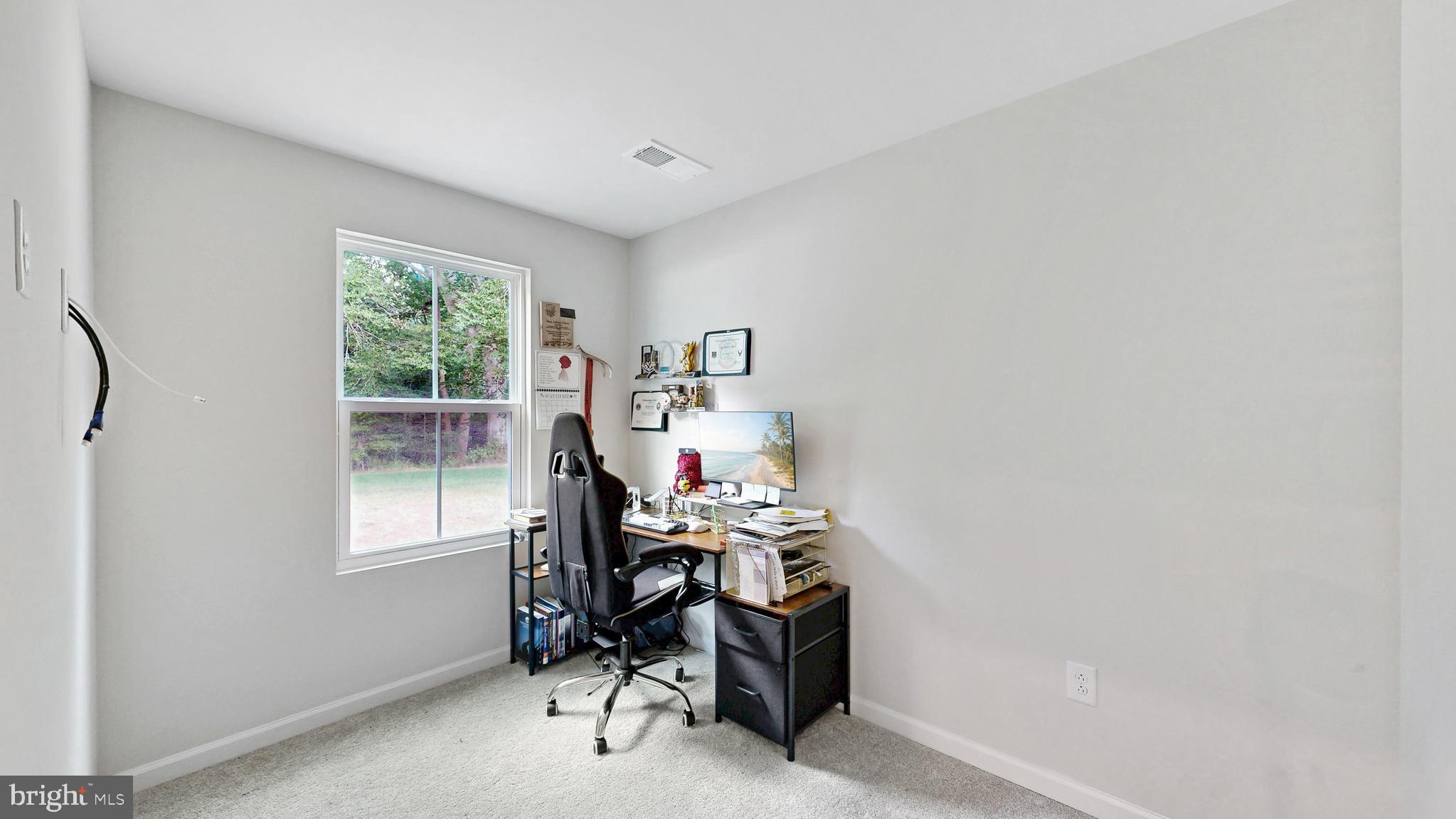 385 Galena Road Frederica, DE 19946 - Photo 9 of 41 a view of a workspace with furniture and a window