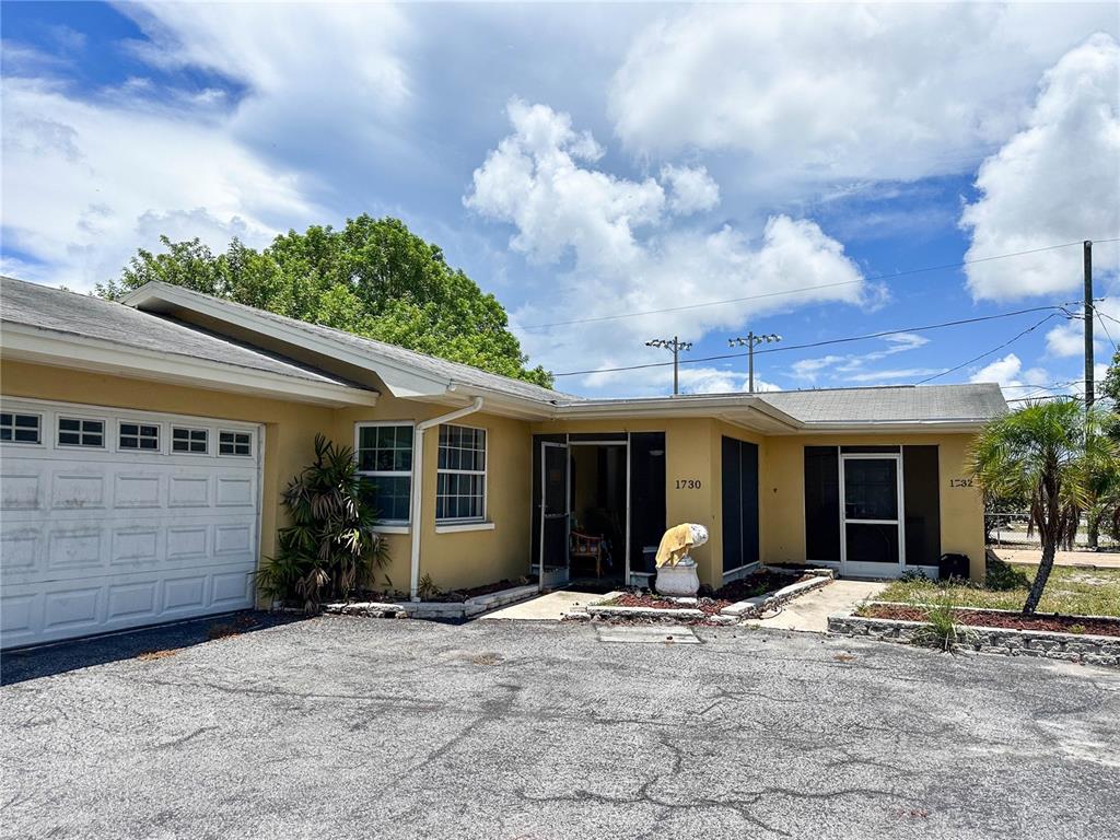 1730 Kenneth Place Clearwater, FL 33755 - Photo 1 of 1 a view of a house with backyard porch and sitting area
